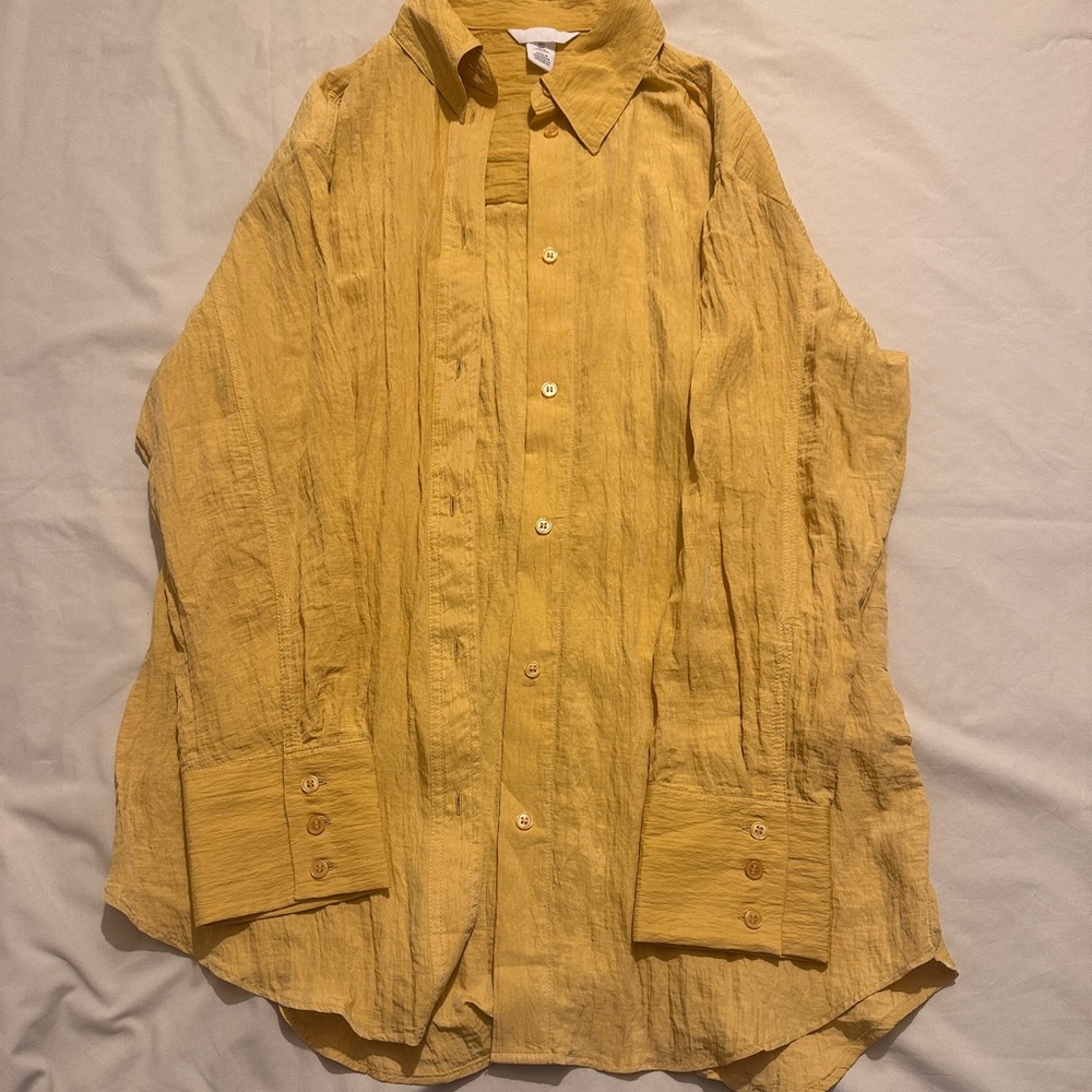 Yellow button down shirt